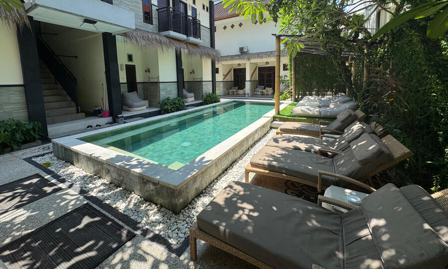 Swim & Chill Swimming pool with lounge area and garden