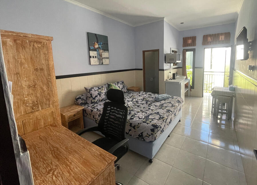 Private Upper floor studio room at Nomads Home Bali Work area with desk and Dual Fiber - WiFi at Nomads Home Bali